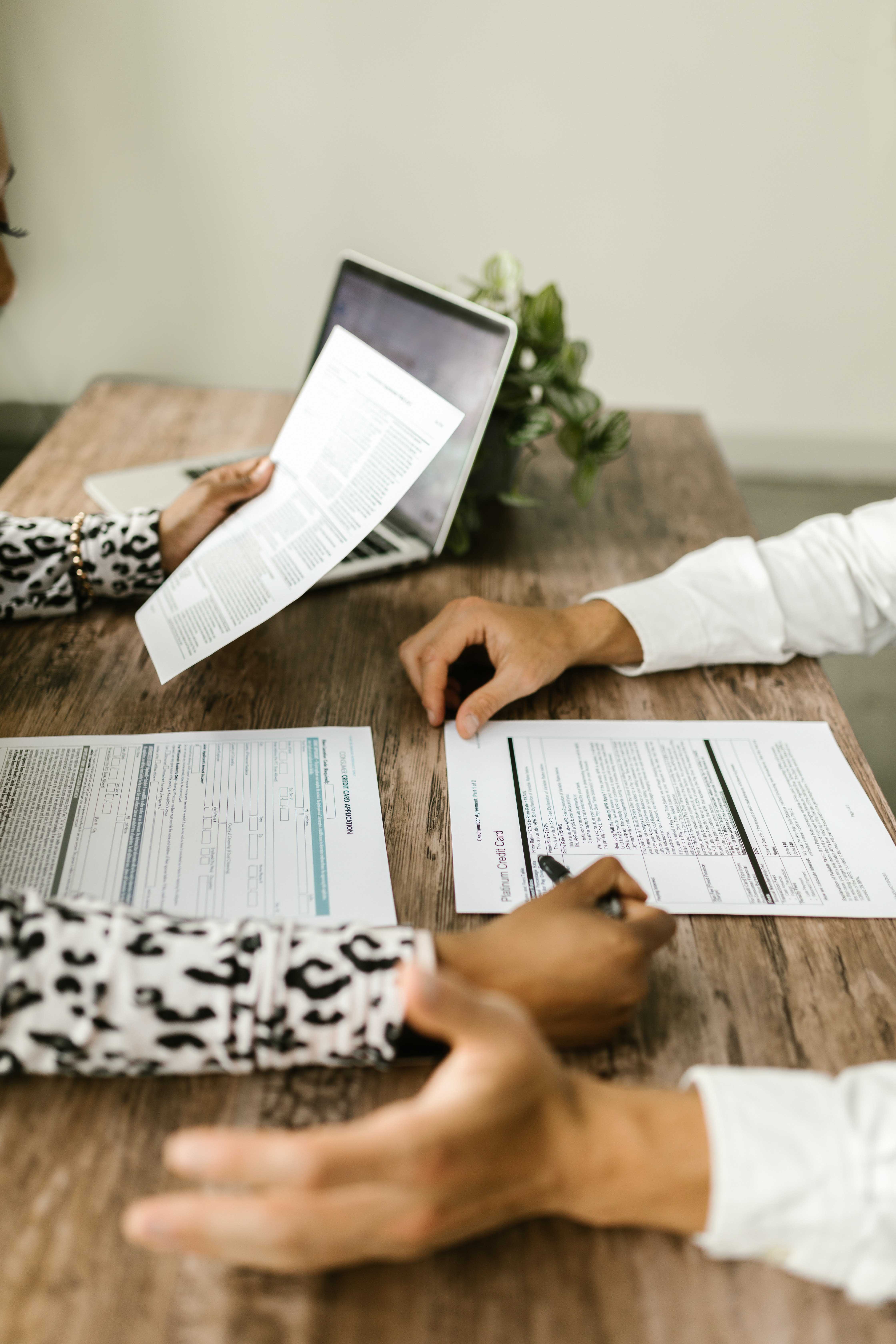 two people looking at paper application