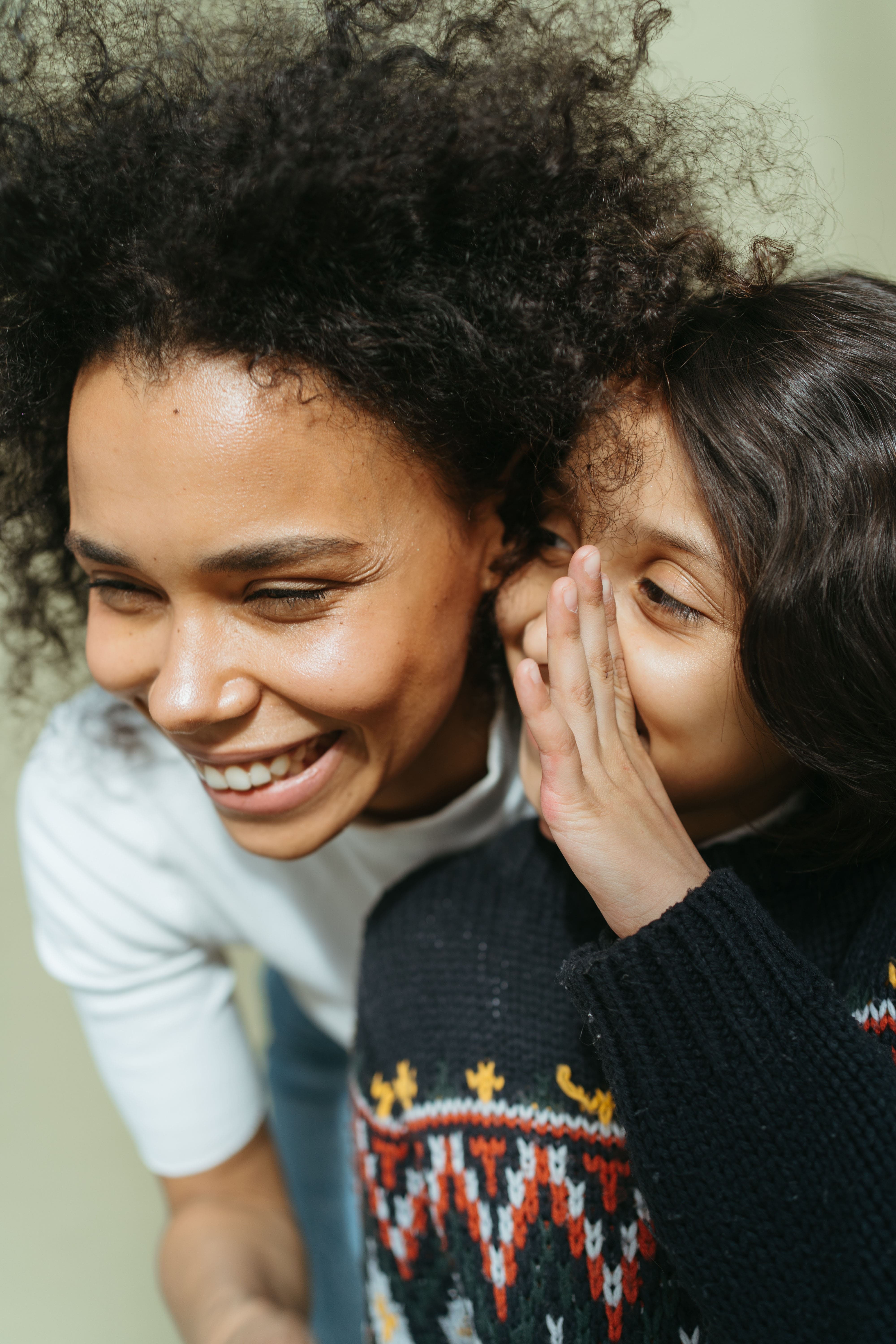 daughter talking to mom smiling