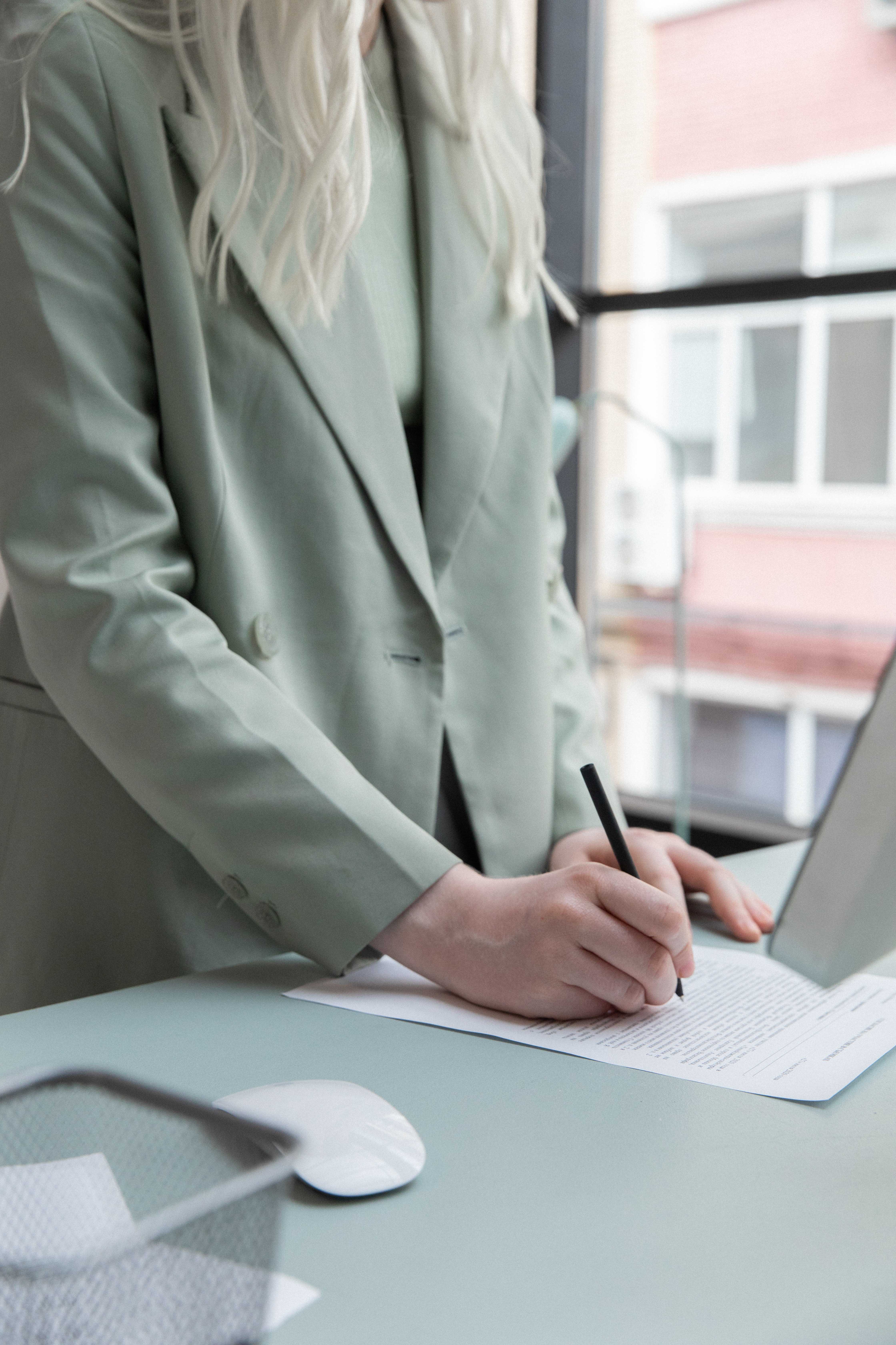 woman writing on paper Beam application